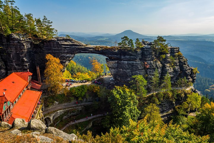 Marvel at the stunning Pravcicka Gate Europe's largest sandstone arch surrounded by lush greenery and breathtaking views perfect for unforgettable memories and exploration in Bohemian and Saxon Switzerland.